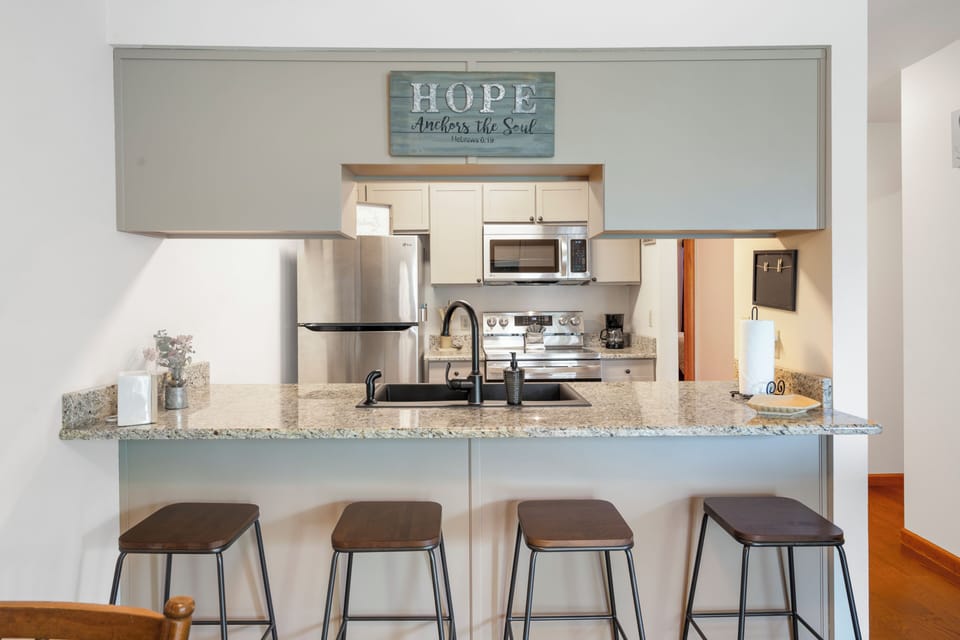 Sip morning coffee or grab a bite at the kitchen counter, seating 4