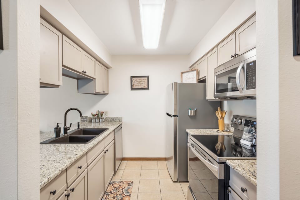 The warm, inviting kitchen offers ample space & every home comfort