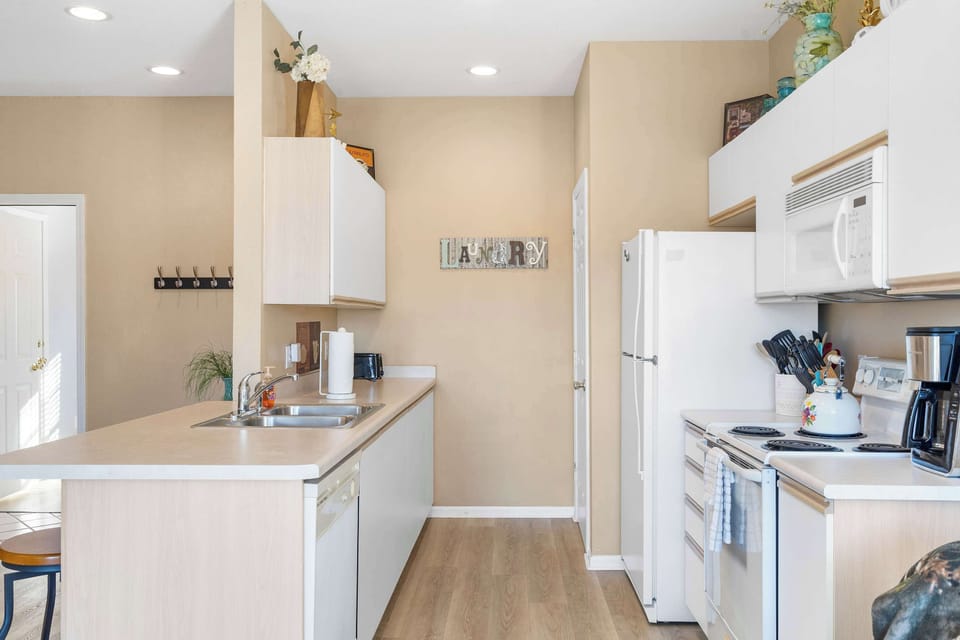 The open, airy kitchen offers ample space & all the comforts of home