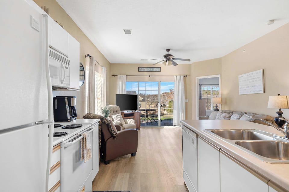 The open, airy kitchen offers ample space & all the comforts of home