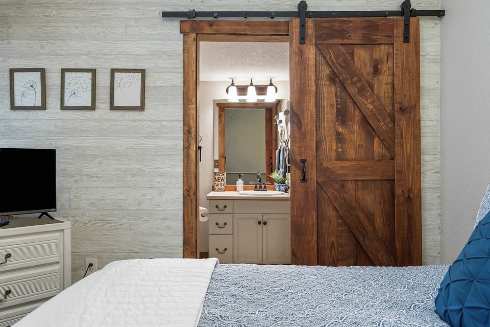 The loft bedroom suite includes a regal queen bed, ensuite, & smart TV