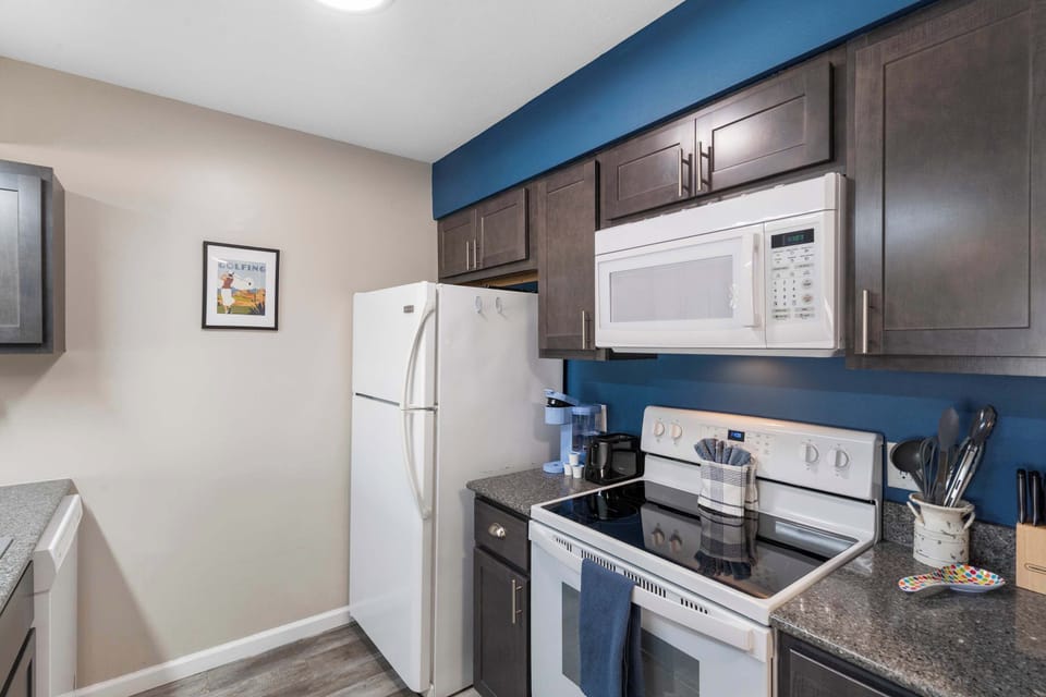 The open, airy kitchen offers ample space & all the comforts of home