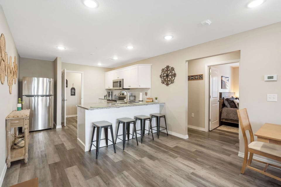 The open, airy kitchen offers ample space & every home comfort
