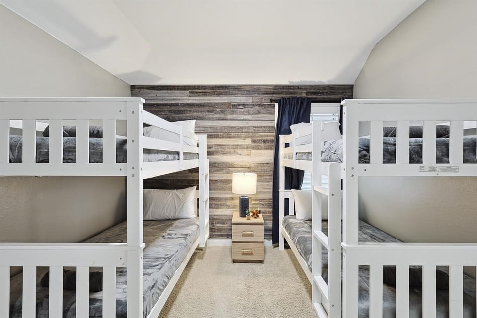 Can’t decide if you prefer the top bunk or the bottom bunk? With two bunk beds available in this bedroom, there are double the options for you to choose from!