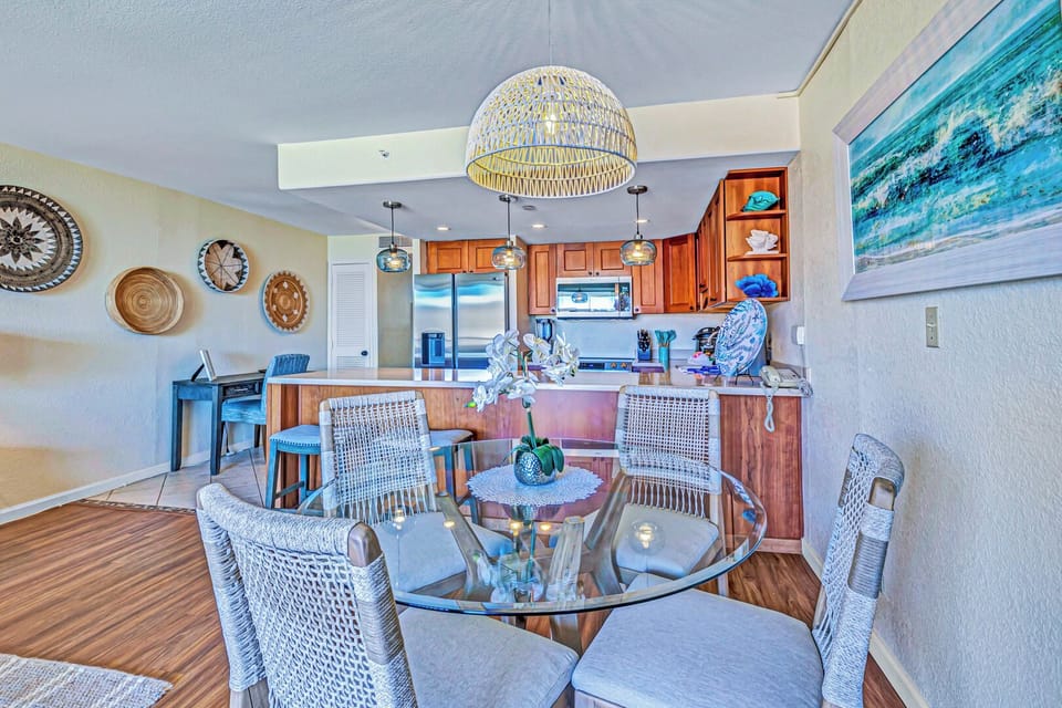 The dining area at Kaanapali Shores 746 offers seating for four, bathed in natural light from nearby windows.