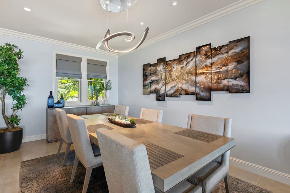 Gather for laughter and shared meals in the welcoming dining area at Wailea Luxury Residence Hoolei 23-3.