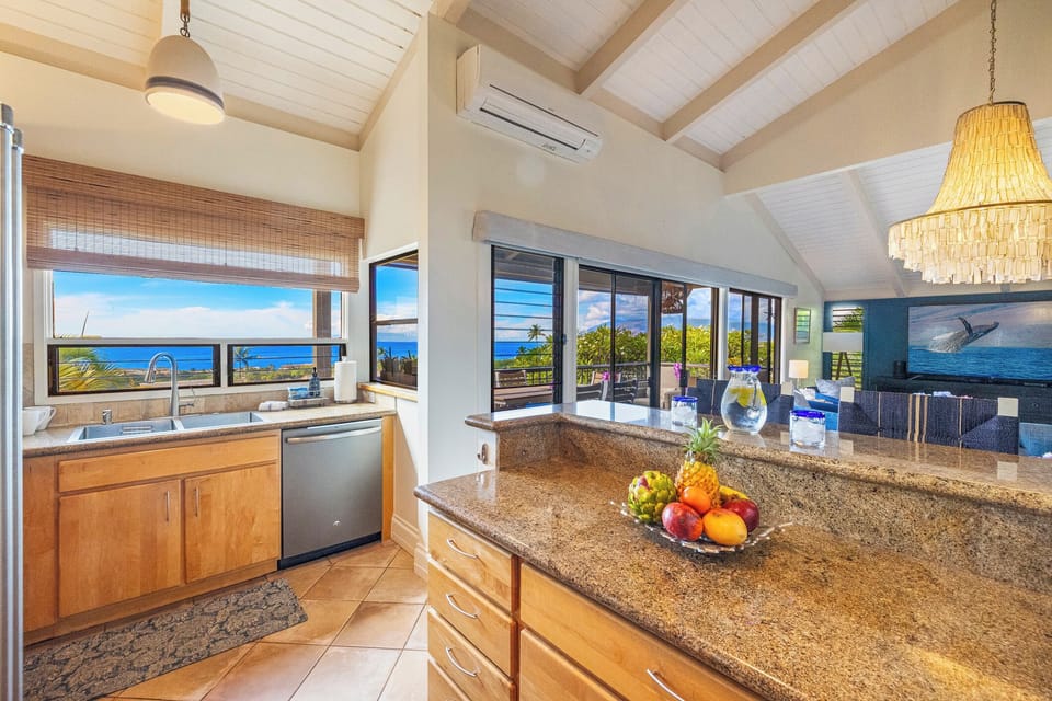 The fully equipped kitchen at Wailea Ekolu 1106 has ample counter space for meal prep.