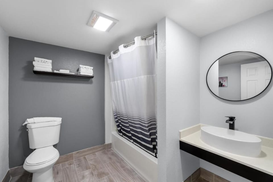 Refresh easily in a bright bathroom with modern vanity.