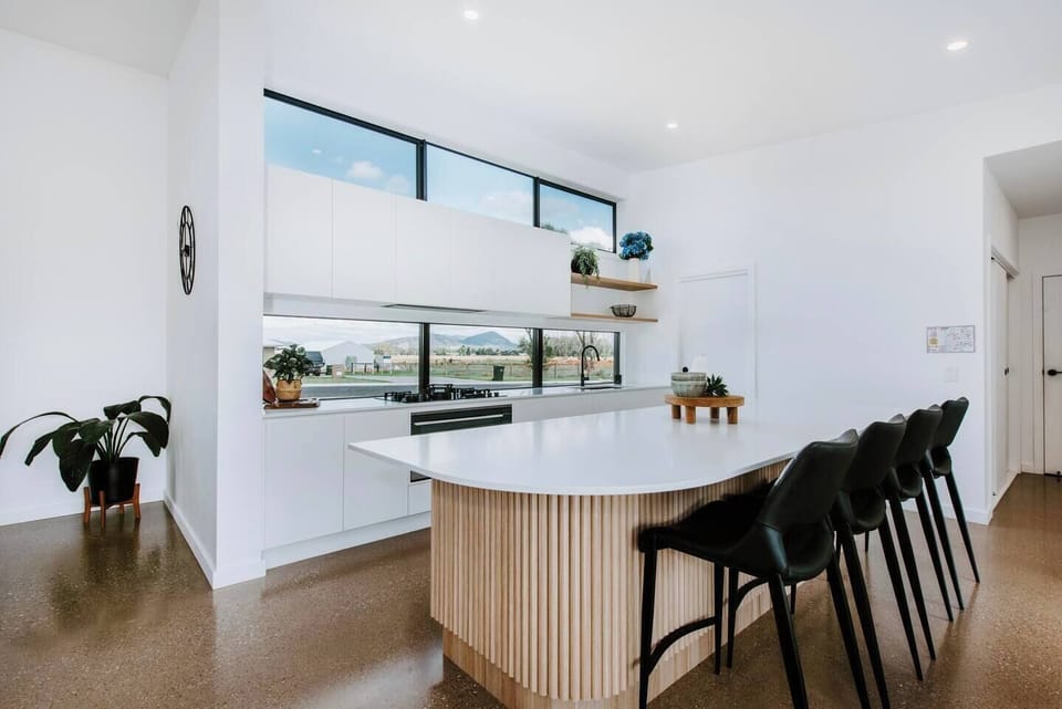 Turn up the heat on the gas stove and serve up some pancakes and breakfast in the kitchen with bar seating. 
