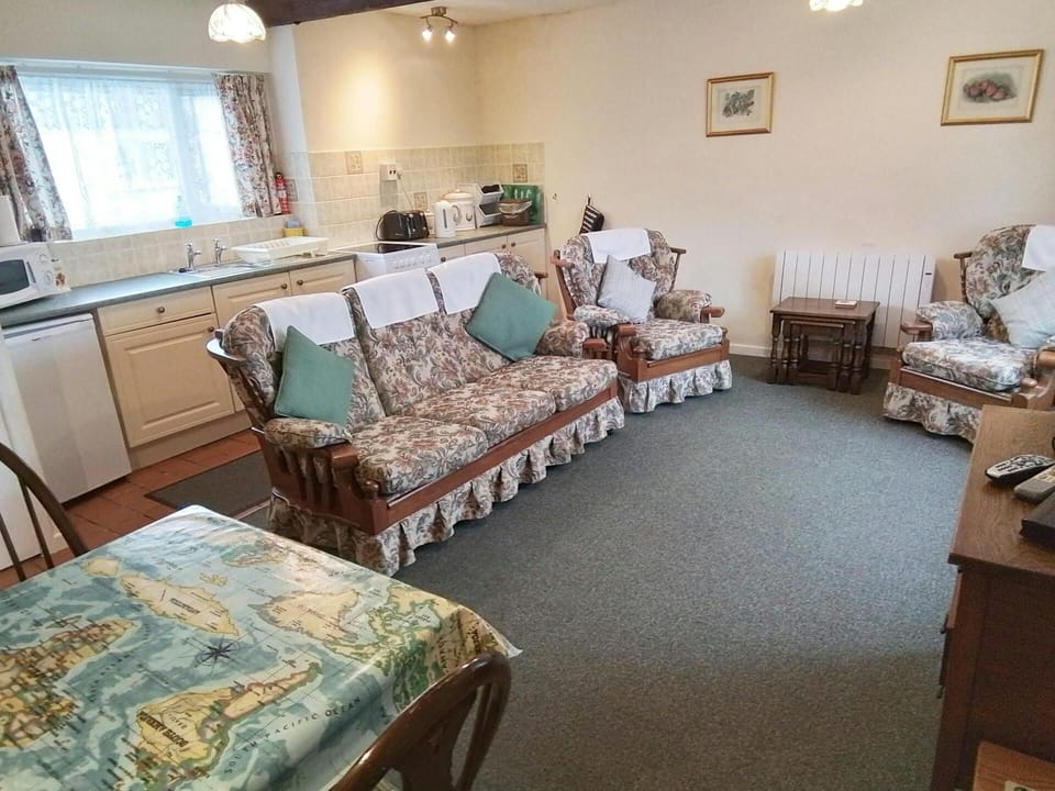Lounge with sofa, armchair and dining table