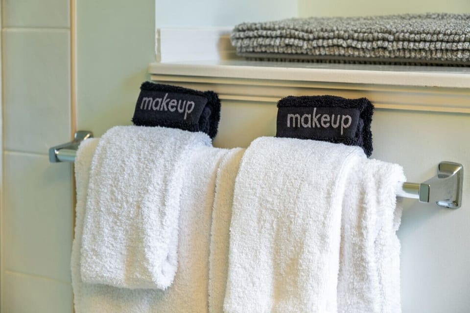 Second bathroom on the upper/main level with a shower/tub combo & essentials (shampoo/conditioner/body wash/hair dryer.)