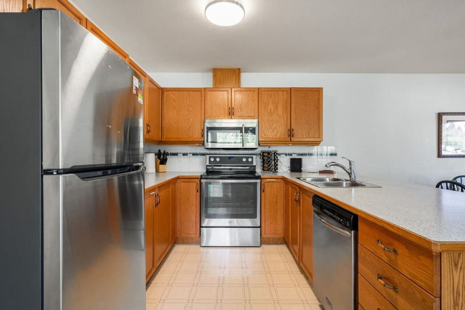 Full kitchen complete with a drip coffee maker, blender waffle maker, mixer & more.