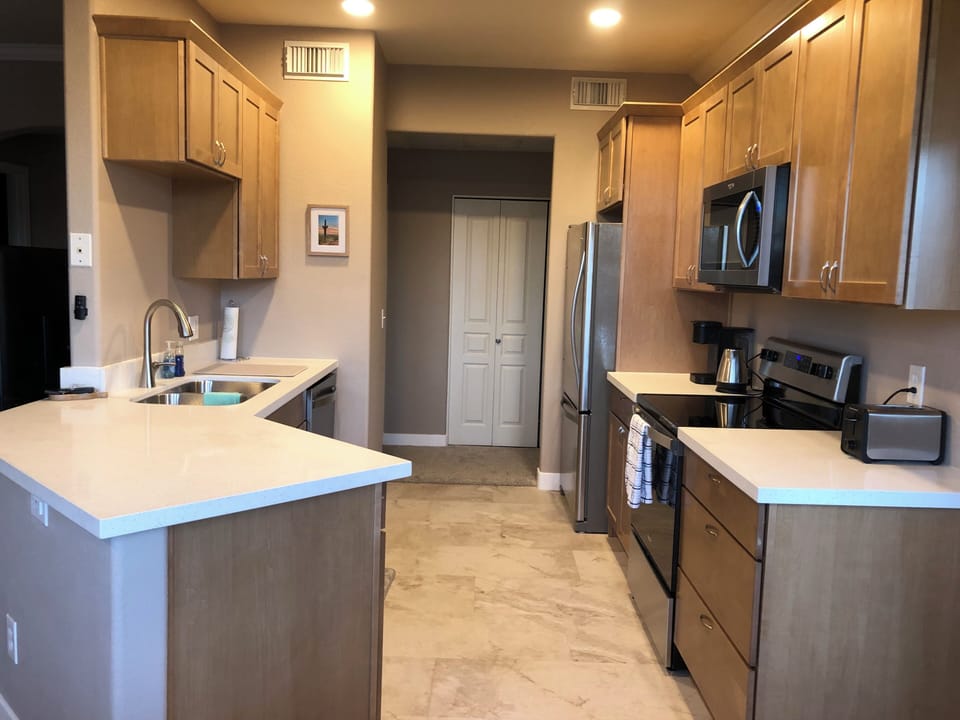 Kitchen featuring everything you'd need to make delicious meals at home