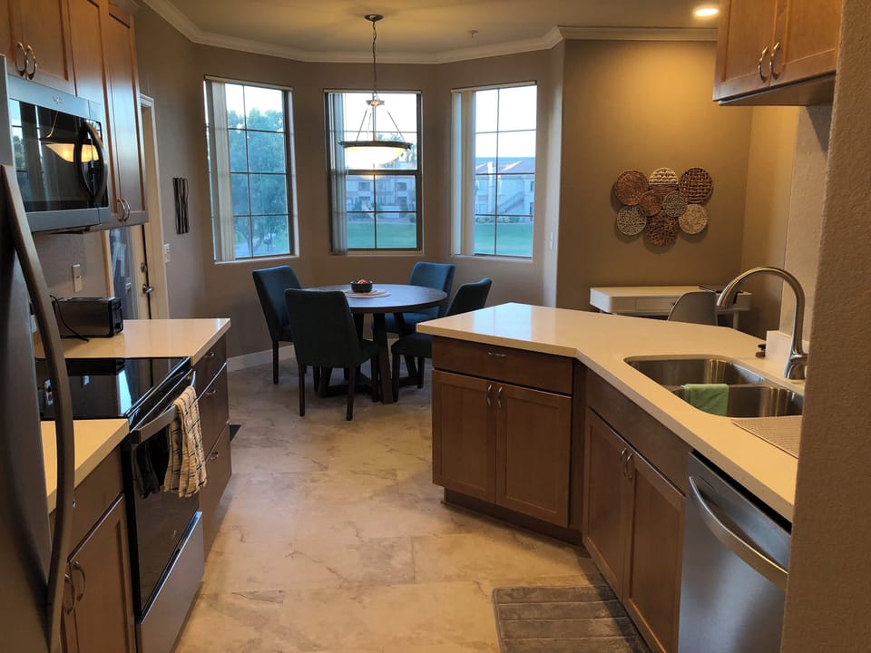 Kitchen featuring stainless steel appliances and eating space for four
