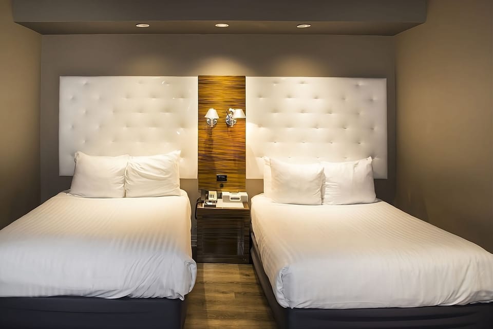Settle into crisp double beds for effortless restful sleep.
