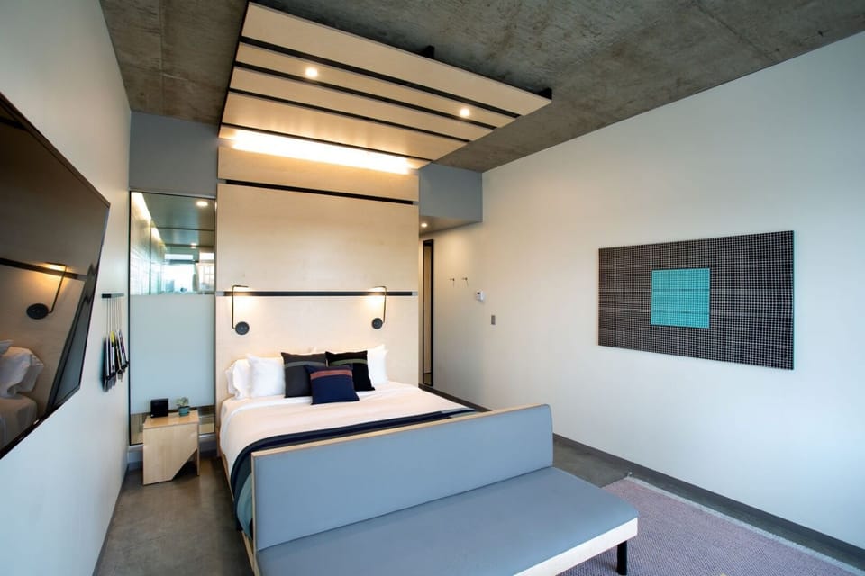 Stretch out in a spacious bedroom with striking modern lines.