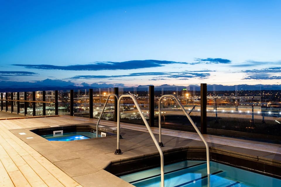 Soak after a long day with panoramic sunset skyline views