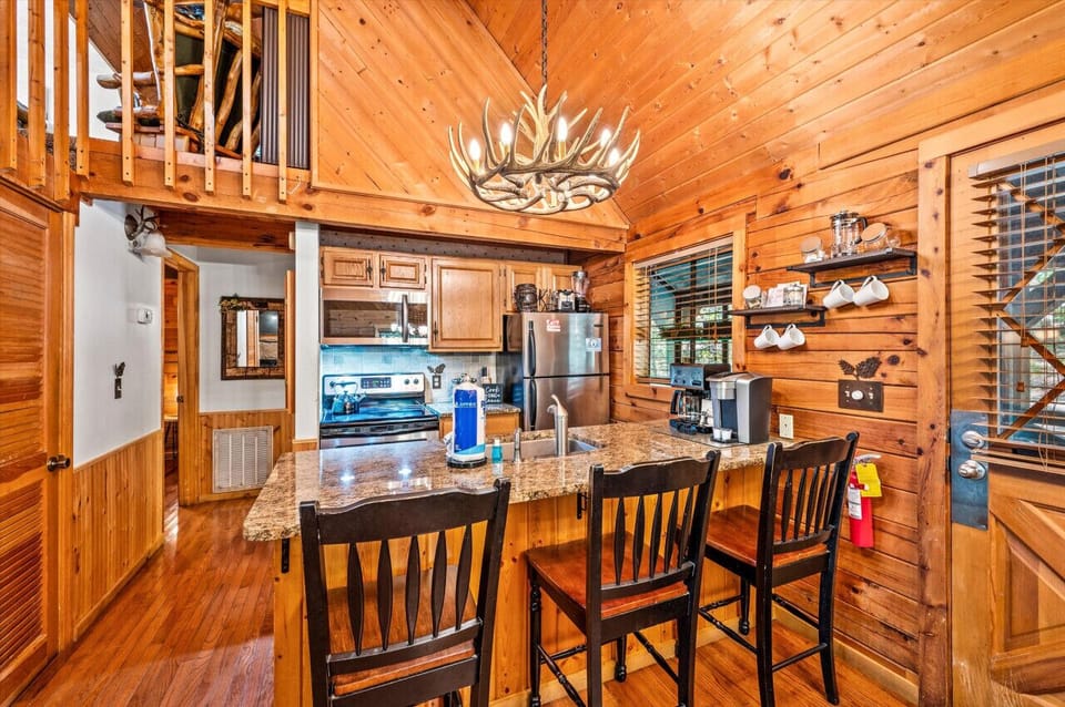Fully Stocked kitchen with bar seating for 3 perfect for morning coffee