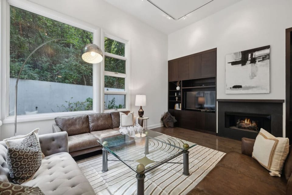 Family Room with ample seating, Smart TV, fireplace and more