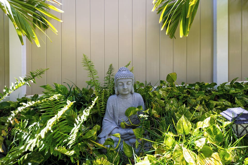 Birds of Paradise, pink ginger, and palm trees surround you.