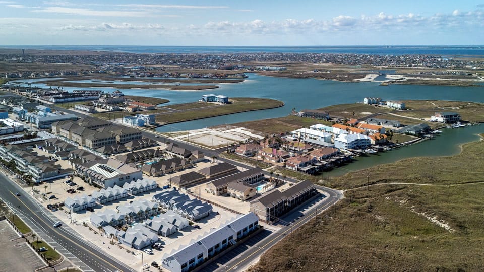 Ocean breezes and stunning homes—capturing the essence of laid-back coastal beauty from above. ✨