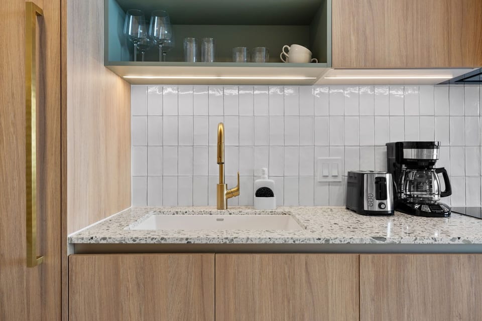 This kitchen offers an abundance of space, making it easy to move around and cook with comfort. With modern fixtures and ample storage.