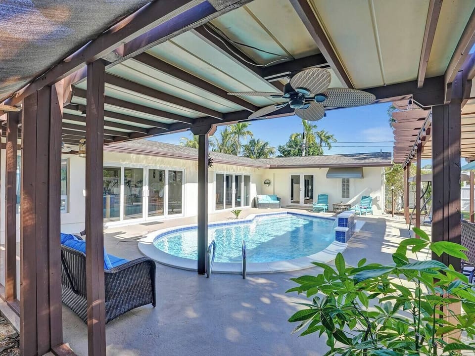Backyard comes equipped with plenty of seating and of course a heated pool!