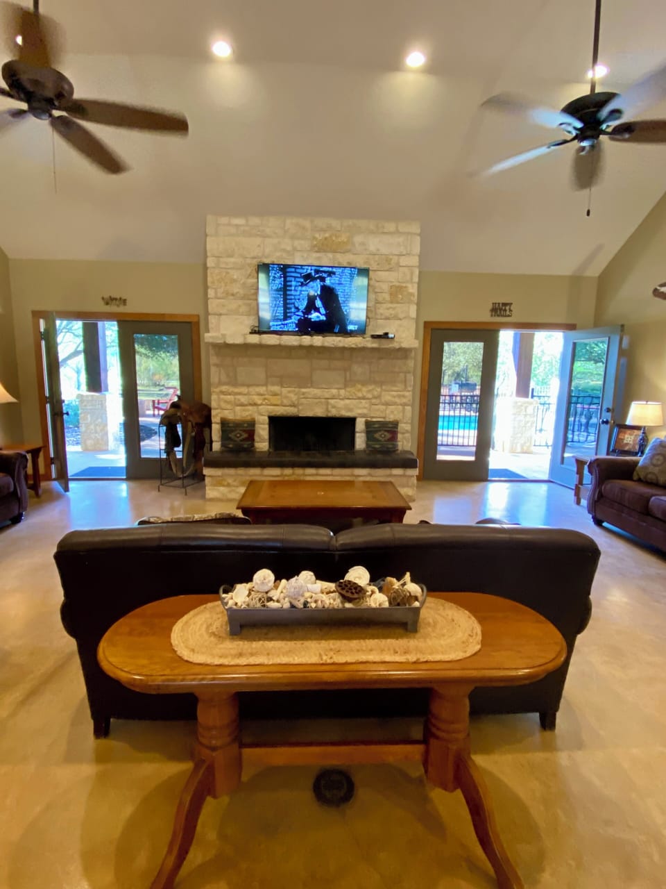 COPA VINO - The great room has a floor-to-ceiling, wood burning, white rock fireplace flanked by 2 french doors overlooking the pool.