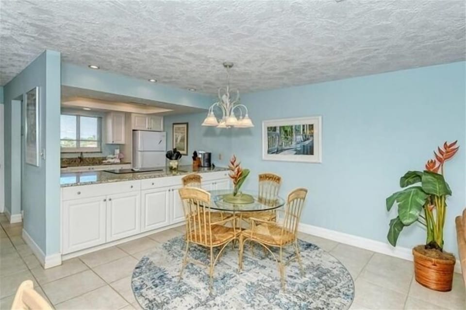 Dining Area - Plenty of storage and cabinet space in this updated condominium.
