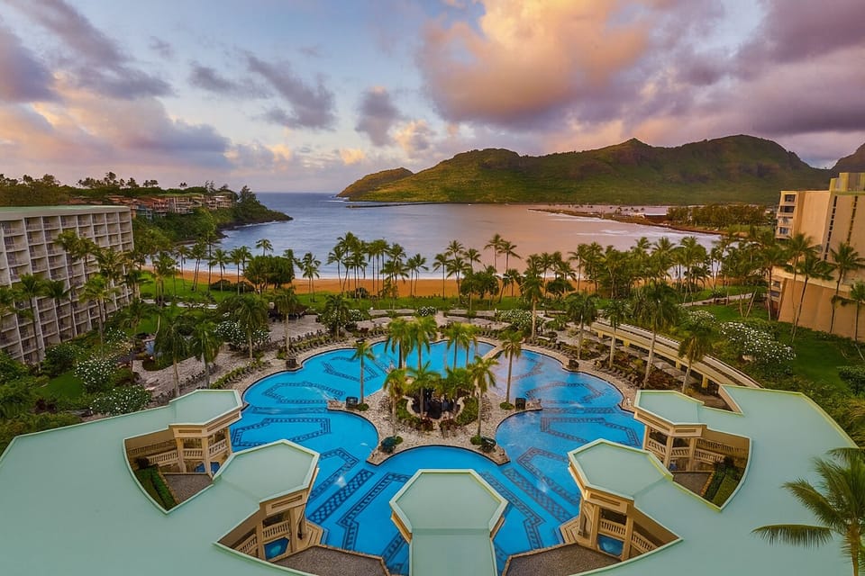 Dive into lagoon-style pools with sweeping ocean sunsets.