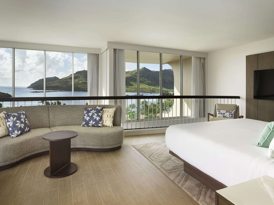 Wake up to panoramic windows, plush bed, and island breezes.