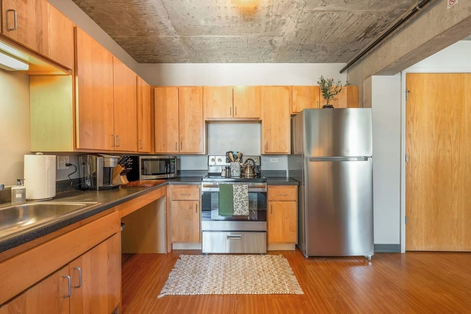 Cook with ease in this bright, well-stocked kitchen featuring modern appliances.