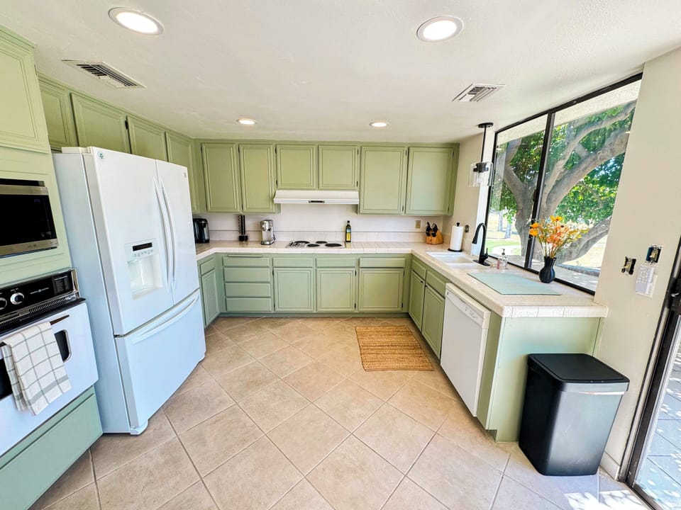 Plenty of space for multiple cooks in this large and sun filled kitchen. 