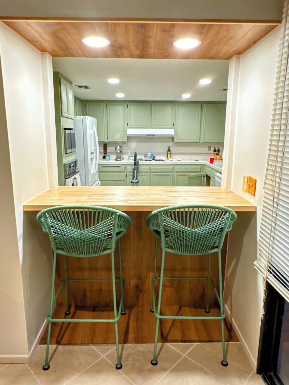 Enjoy a quick bite on the butcher block breakfast bar. 