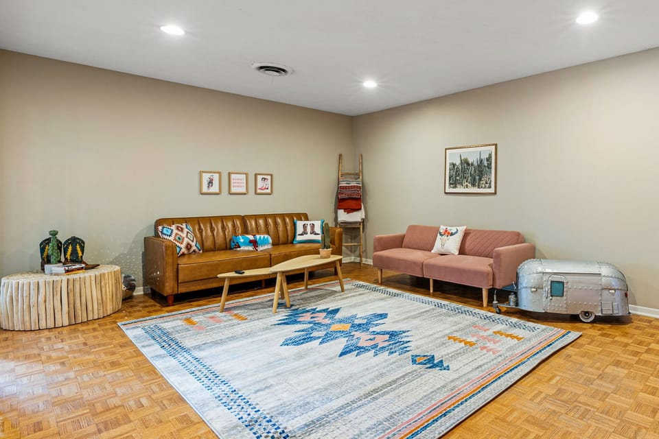 Cohesive decor with two sofa's in the living room.  Sofa's lay flat for sleeping