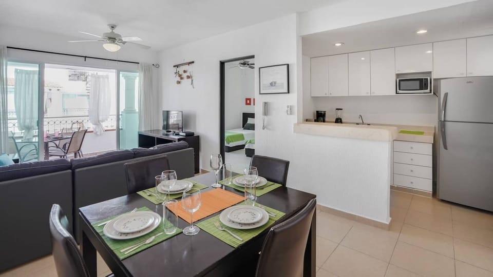 Full kitchen with stove, oven, full refrigerator, microwave, blender, coffee machine. Dining area, 4 chairs available