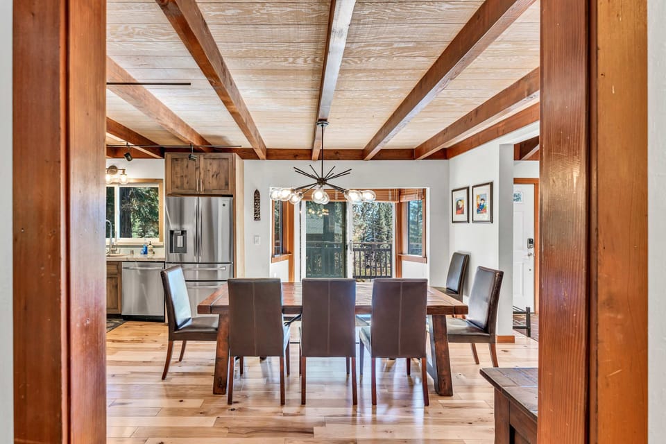 Dining Room: 9-person dining table, open layout to kitchen and living room