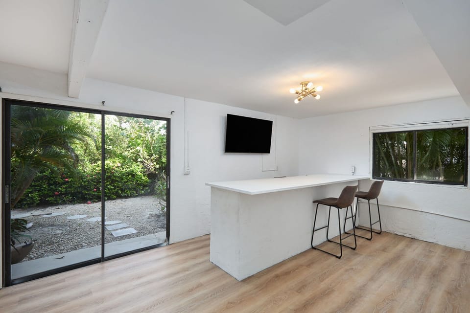 Bonus room with bar and TV located on ground floor off garage. Perfect for entertaining.