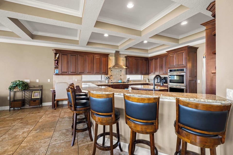 Whip up your favorite meals in this fully stocked kitchen with a large island and high seating—perfect for casual dining and conversation