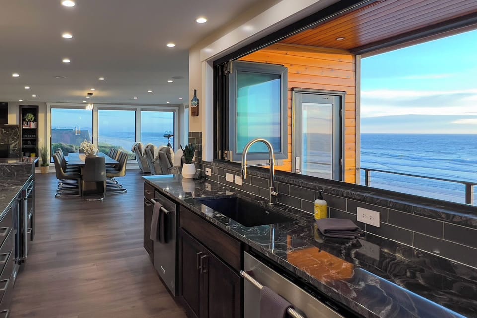 Pass through kitchen window allows you to listen to the ocean while you cook.
