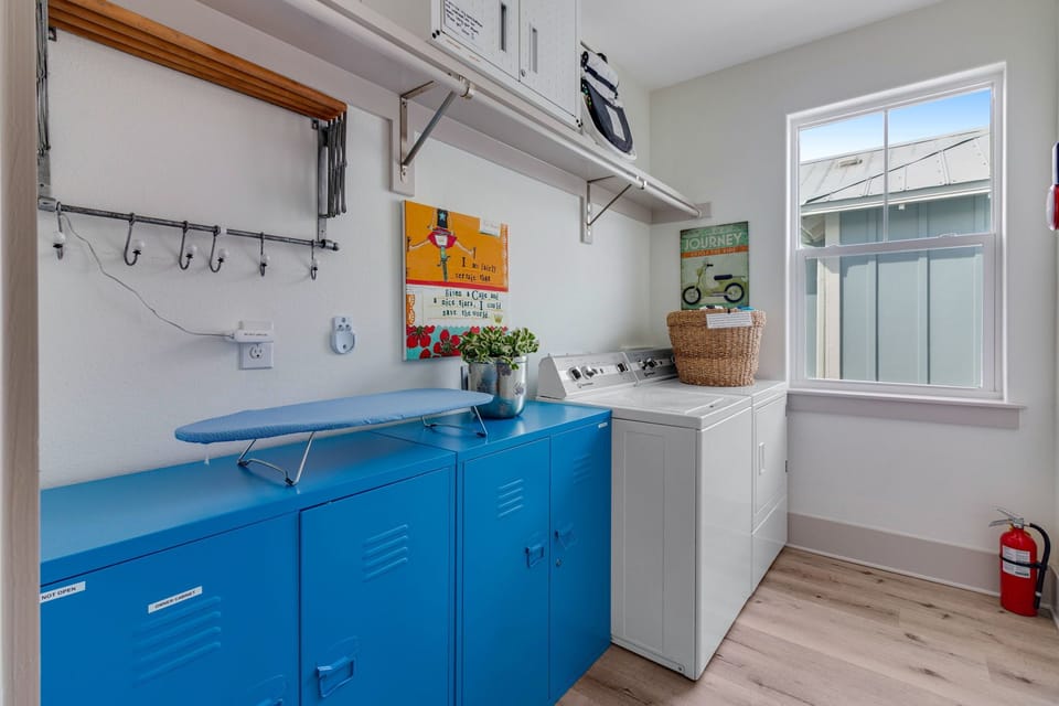 Laundry room with washer and dryer in separate room. 
