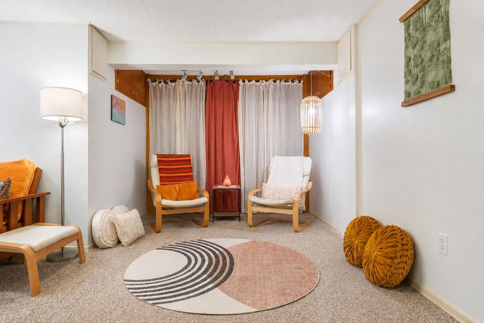 Sitting area with meditation chairs, yoga mat and cushions for  relaxing