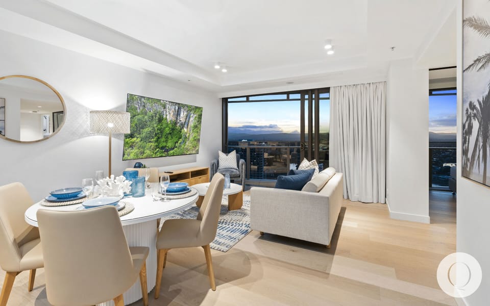 The elegant dining area is right next to the living area and the balcony