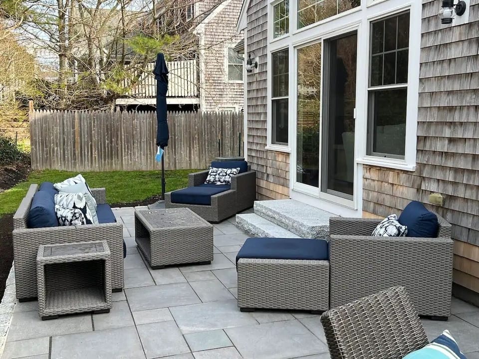 Updated patio with plenty of seating includes a dining table for 8, BBQ grill, and outdoor furniture (1)