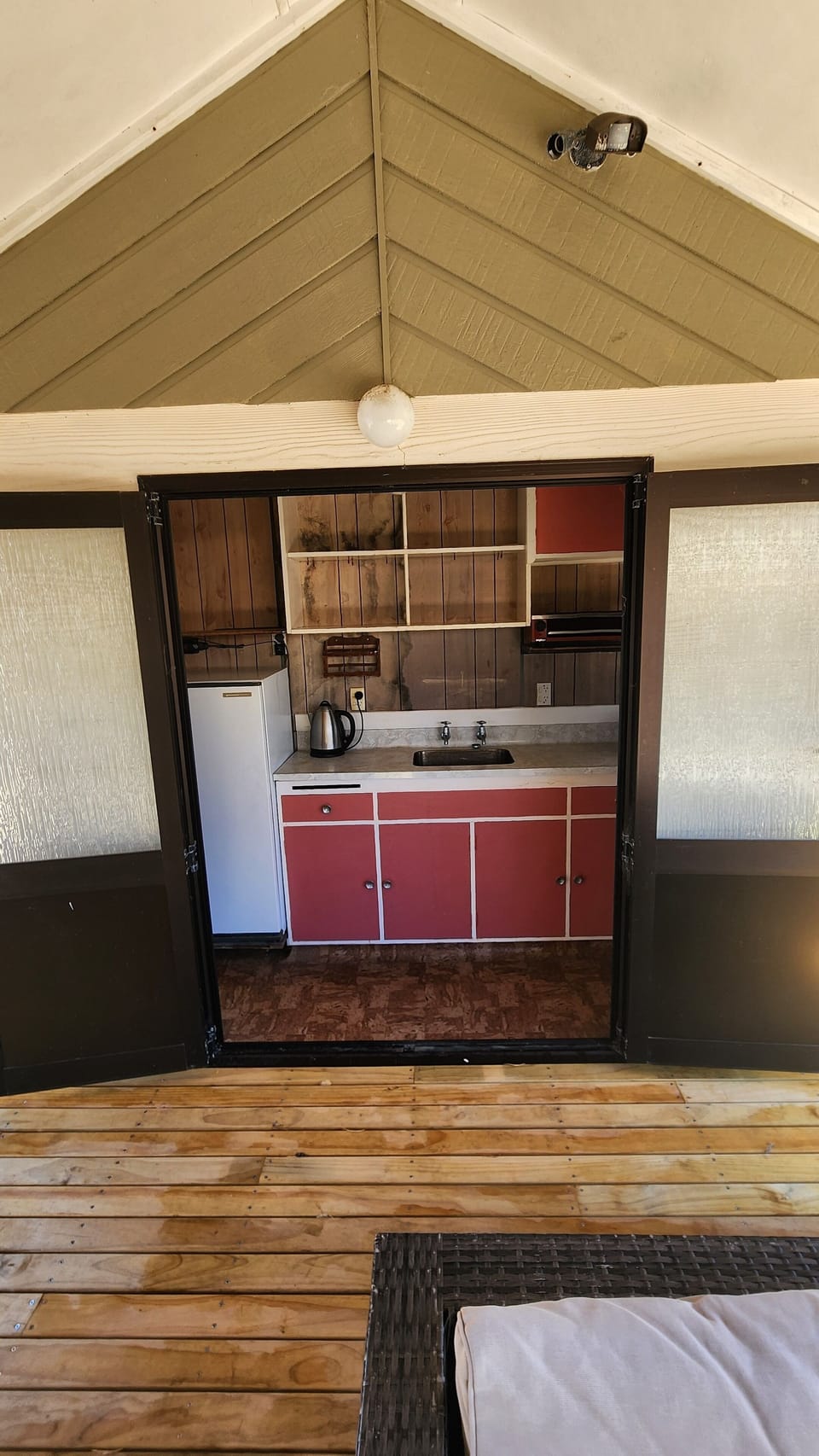 utility with shower, toilet, small kitchen