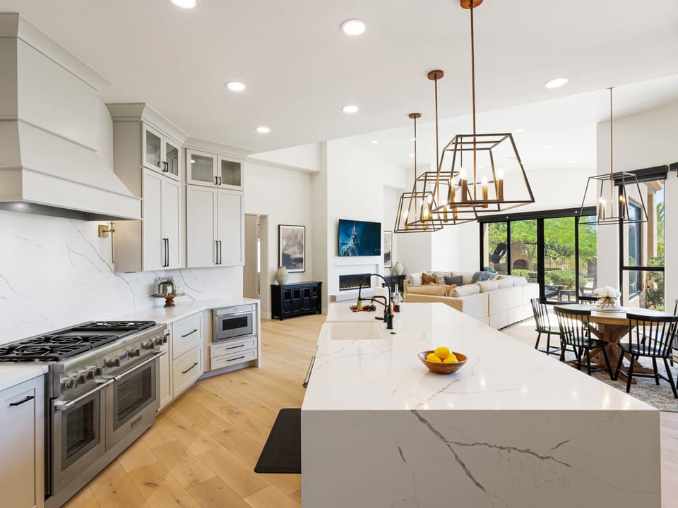 Fully equipped kitchen with stainless steel appliances, a Scotsman Ice Maker, and bar seating for 6 guests.