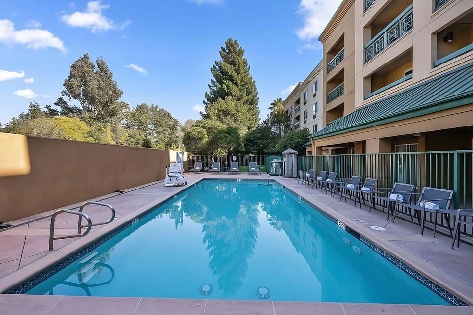 Dive into a sparkling pool framed by sunny relaxation.