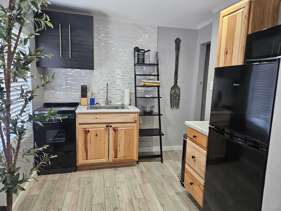 The kitchen was recently updated with a full sized refrigerator, electric stove and oven. New pots and pans are in stock and ready to cook a delicious meal!