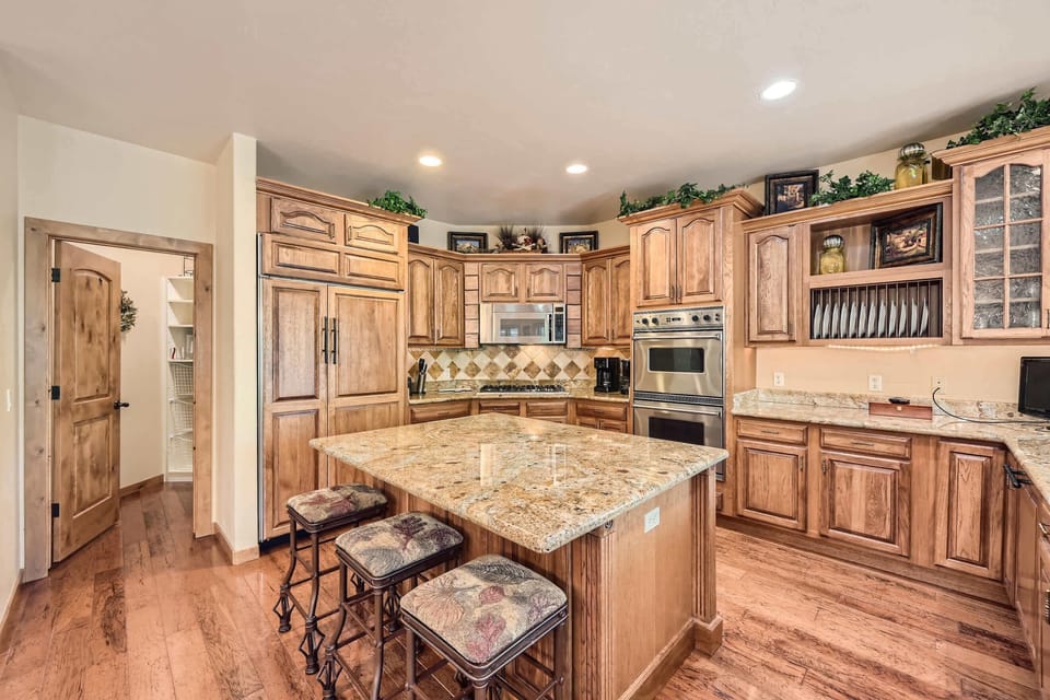 The warm, open kitchen offers ample space & all the comforts of home
