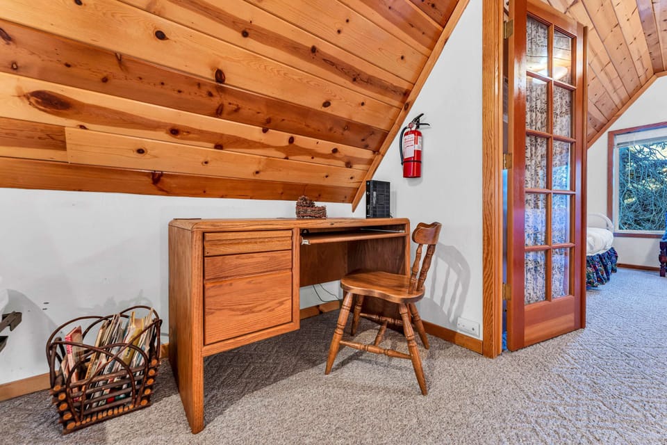 Loft: A foosball table, dedicated workspace, twin bed, upper floor
